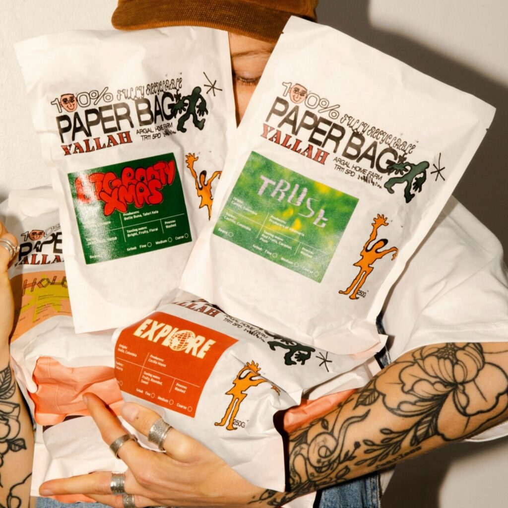 Small-batch printed coffee bags lined up for retail