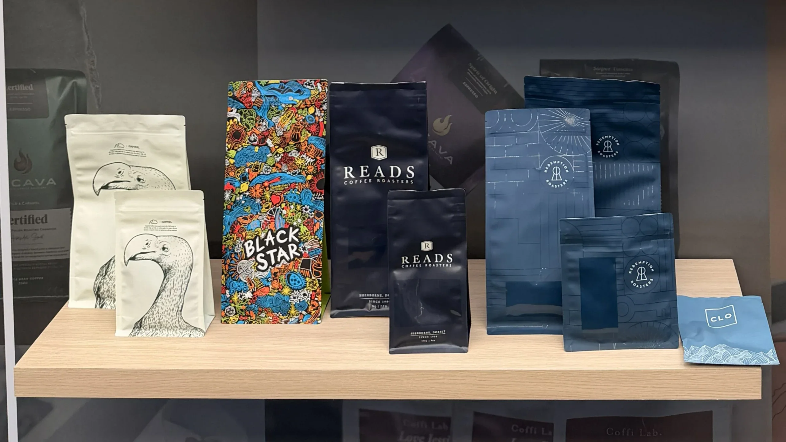 Coffee bag sizes from small samples to wholesale, shown on a shelf