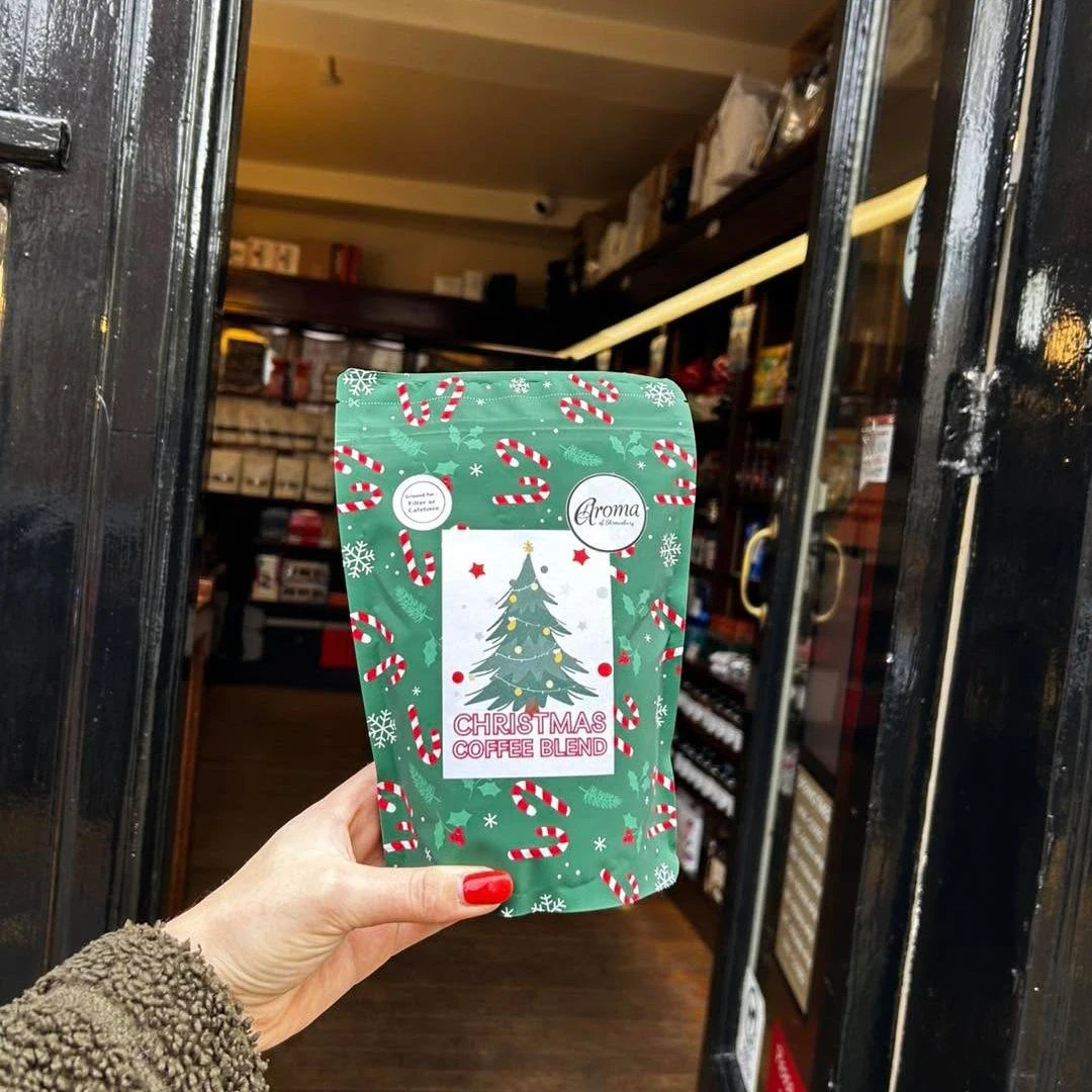 Green Christmas stock packaging pouch dressed with a Christmas sticker