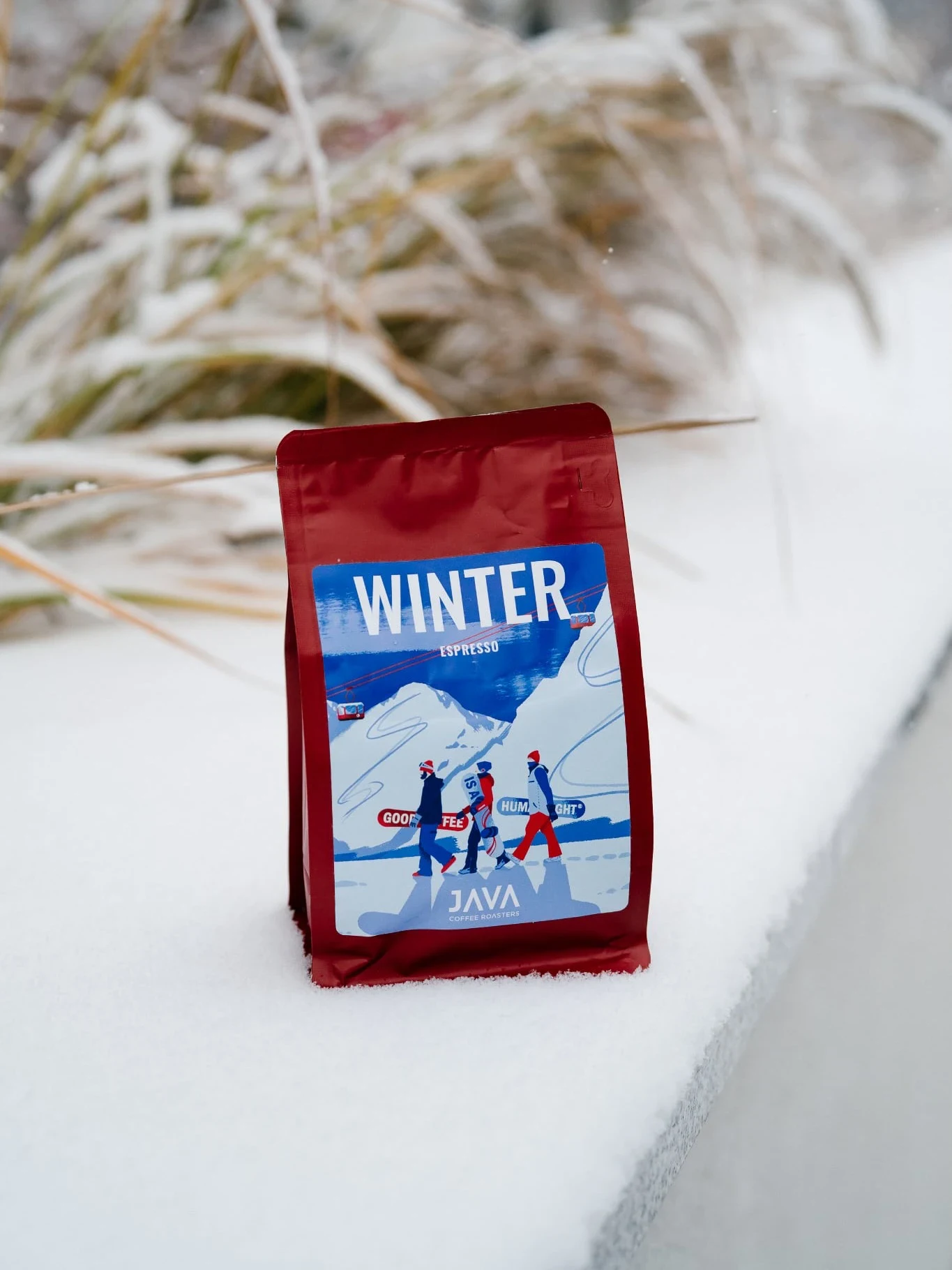 Red stock box bottom bag with a winter-theme sticker, an example of colour-led Christmas styling